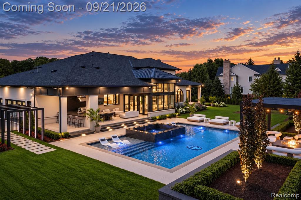 Evening pool and illuminated estate